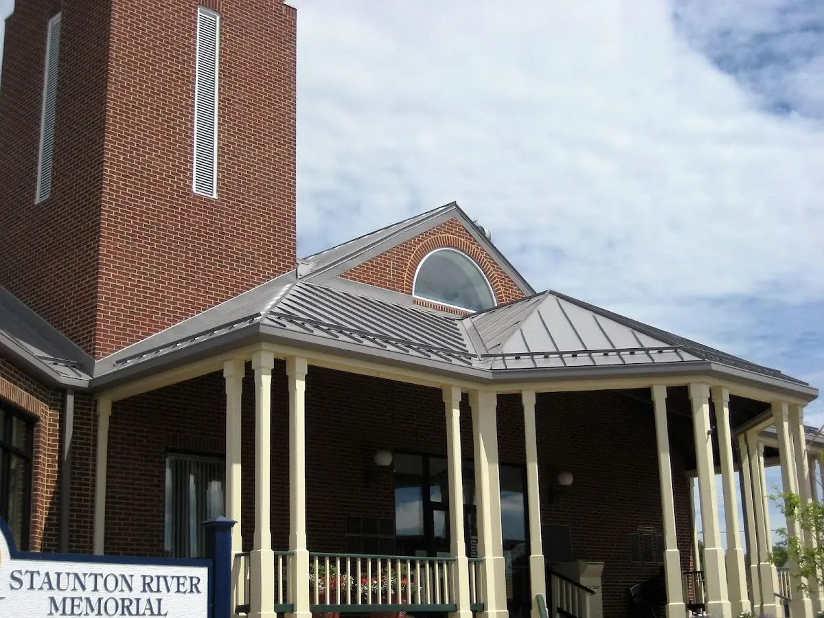 Skilled roofing craftsmen working on a residential roof in West Clarkston-Highland